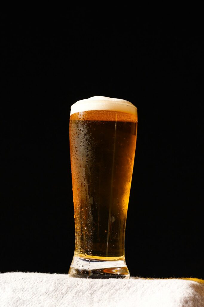 clear drinking glass with beer